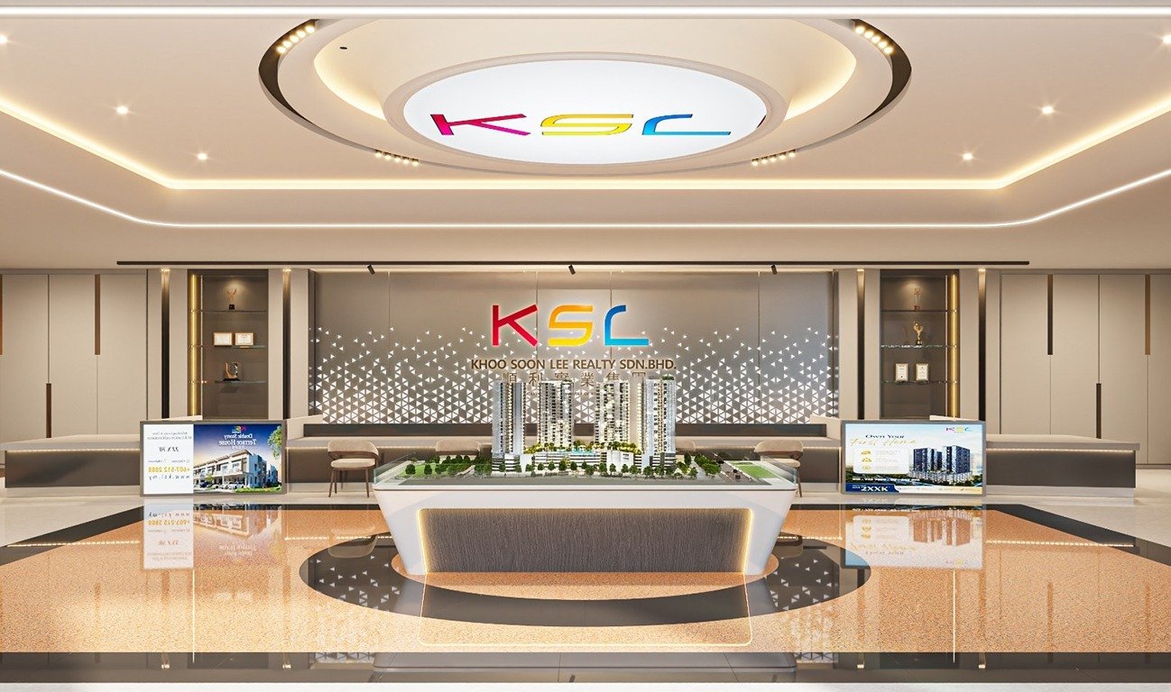 KSL sales gallery with champagne lighting, warm stone finishes and a scale model of the development